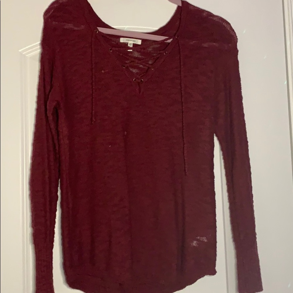 Red sweater with crossover at neck line